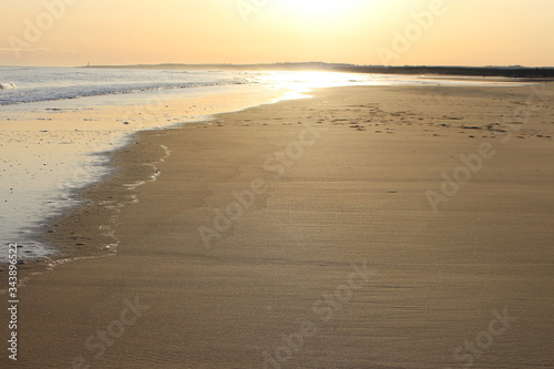 Fototapeta Naklejka Na Ścianę i Meble -  Sun reflection on sea and sand