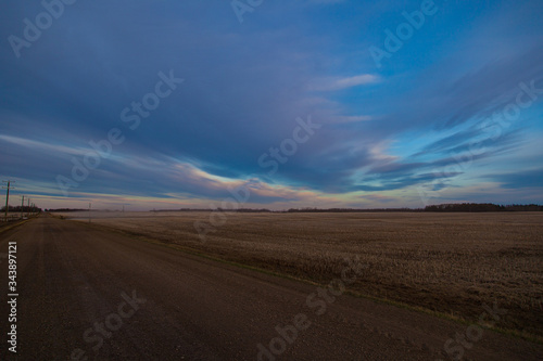 colorful clouds over field