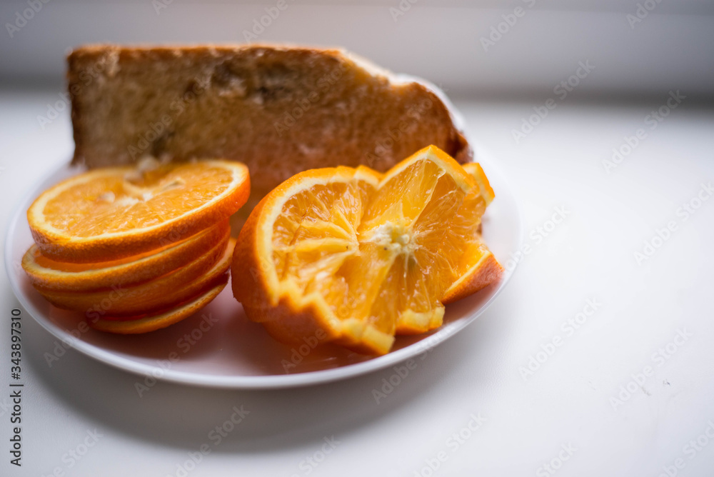 Sliced orange on a white plate