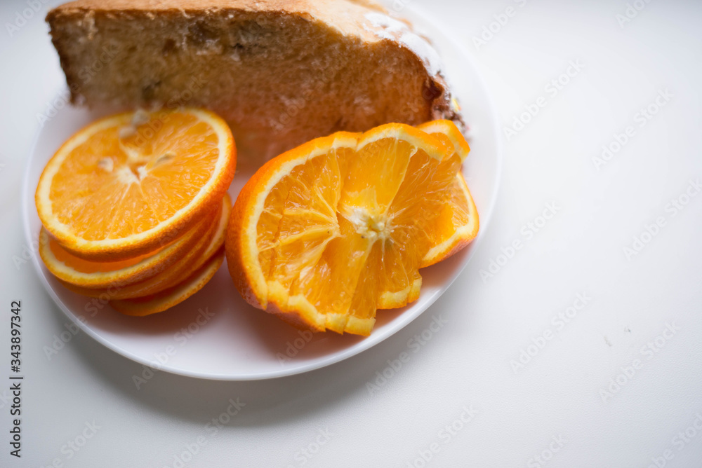 Sliced orange on a white plate Sliced orange on a white plate