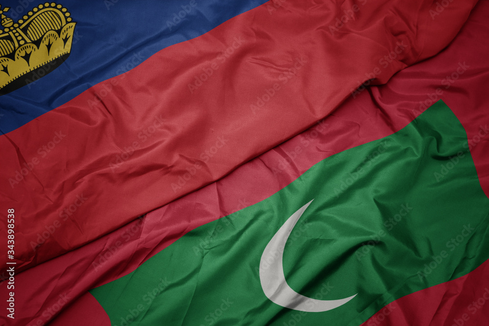 waving colorful flag of maldives and national flag of liechtenstein. waving colorful flag of maldives and national flag of liechtenstein.