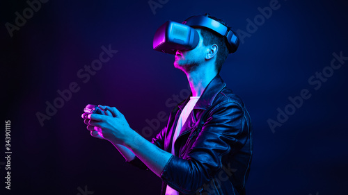 Handsome young man using a virtual reality headset