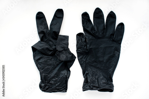 Black medical gloves on a white background