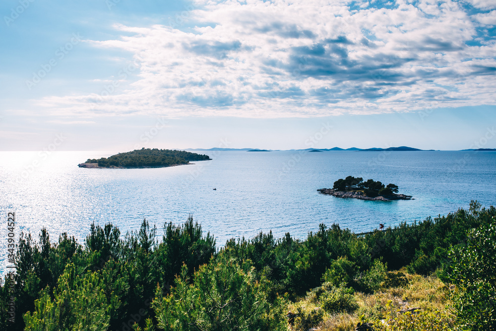 Seascape. Idyllic Mediterranean seascape overlooking nearby islands. Clean turquoise water and lush green vegetation. Vacation background with copy space. Beautiful Mediterranean countries.Croatia