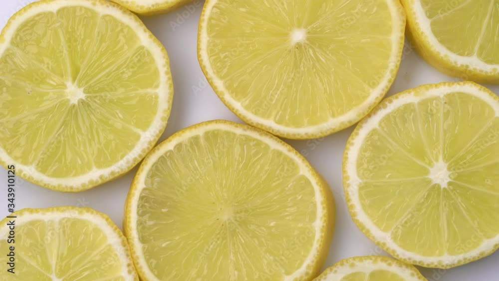 Lemon slices closeup, macro food summer background, fruits top view. Rotate