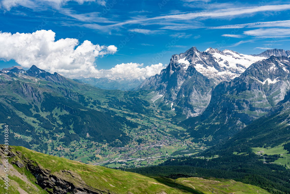 Switzerland, Panoramic view on Grindelwald valley and Wetterhorn and green Alps around