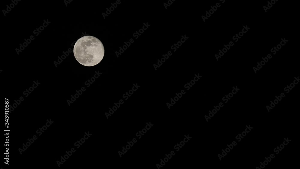 bright and romantic full moon in the black night sky bright and romantic full moon in the black night sky