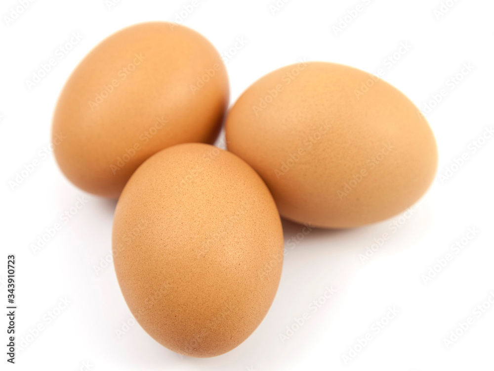 Brown eggs on white background