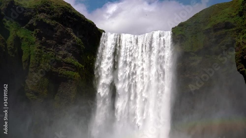 Iceland waterfall Skogafoss in Icelandic nature landscape. Famous tourist attractions and landmarks destination in Icelandic nature landscape on South Iceland.