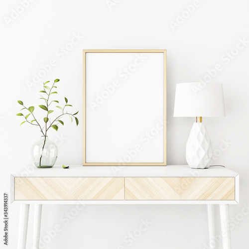 Fototapeta Naklejka Na Ścianę i Meble -  Interior poster mockup with vertical gold metal frame on the console table with green tree branch in vase and  lamp on empty white wall background. A4, A3 size format. 3D rendering, illustration.