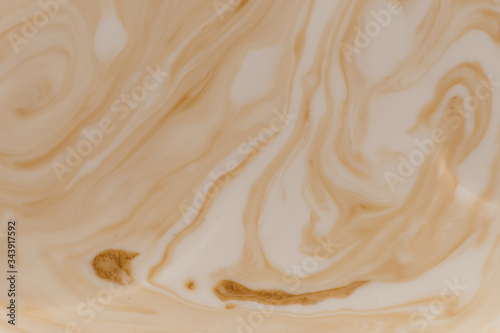 Brown stains in beige liquid 