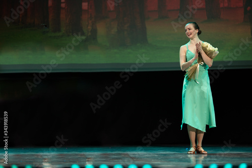 Dancers actors perform in the theater on stage in a dance show photo