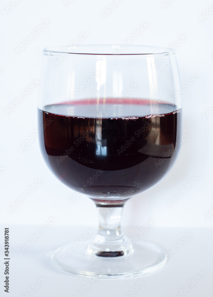 Glass of red wine isolated on white background
