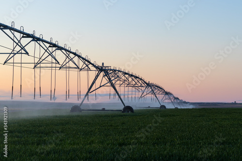 sprinklers watering large crop field in idaho