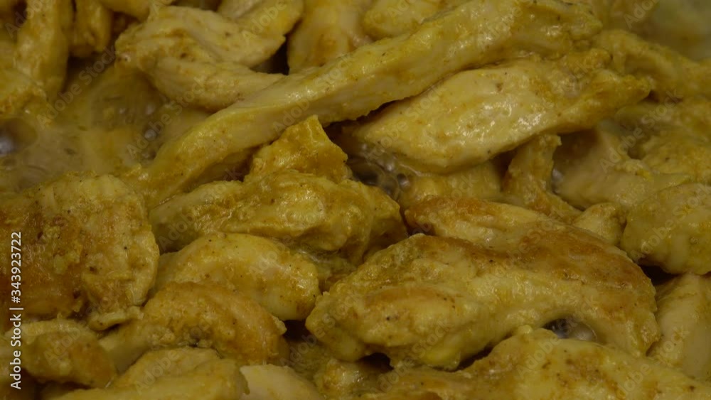 Cooking of chicken stroganoff in white sauce in a frying pan, home cooking Cooking of chicken stroganoff in white sauce in a frying pan, home cooking