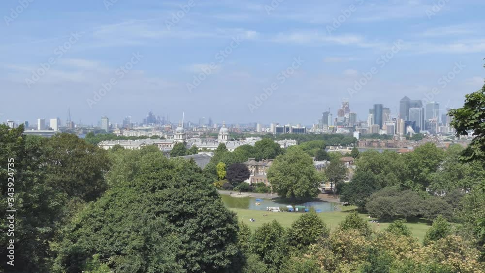An overlook of a pond in the middle of a city park. An overlook of a pond in the middle of a city park.