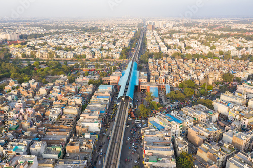 Aerial view of New Delhi public transport system crossing neighborhood, India.