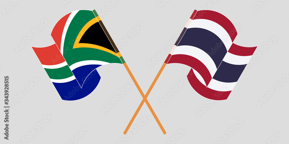 Crossed and waving flags of South Africa and Thailand