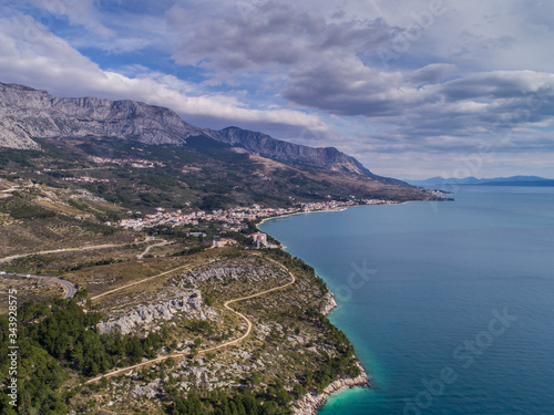 Aerial view of coastline and Tucepi, small touristic place near Makarska in Dalmatia, Croatia. photo