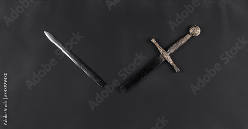 broken sword on a black background