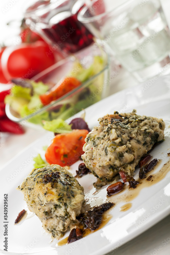 italian strangolapreti dumplings on a plate italian strangolapreti dumplings on a plate