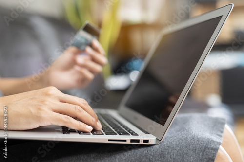 Women shopping online via credit cards. Business and Technology Concepts.