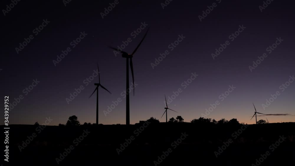 Large Windmills generating green energy at night