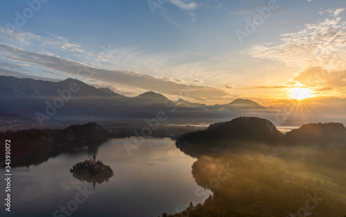 Aerial view of the Bled island and castle at sunrise