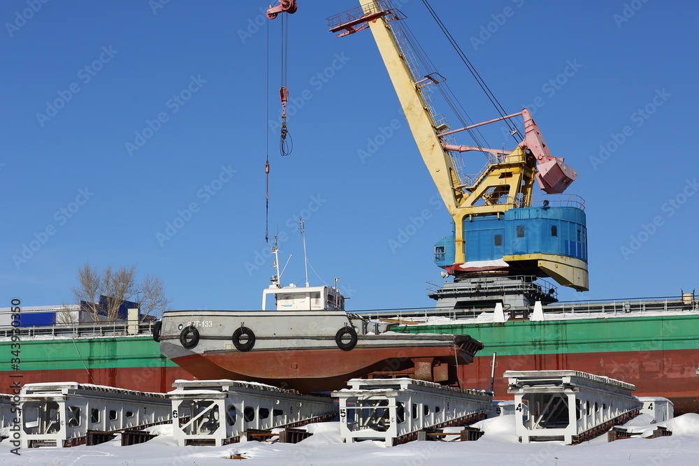 Port cranes at the shipyard on a clear blue sky