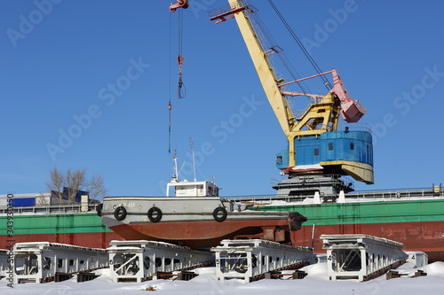 Port cranes at the shipyard on a clear blue sky