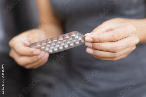 Woman holding combined oral contraceptive pill.Gynecology concept.