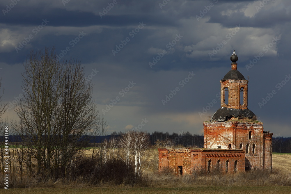 The ruin of an old church against the backdrop of a beautiful sky with beautiful clouds. Russia, Nizhny Novgorod region.