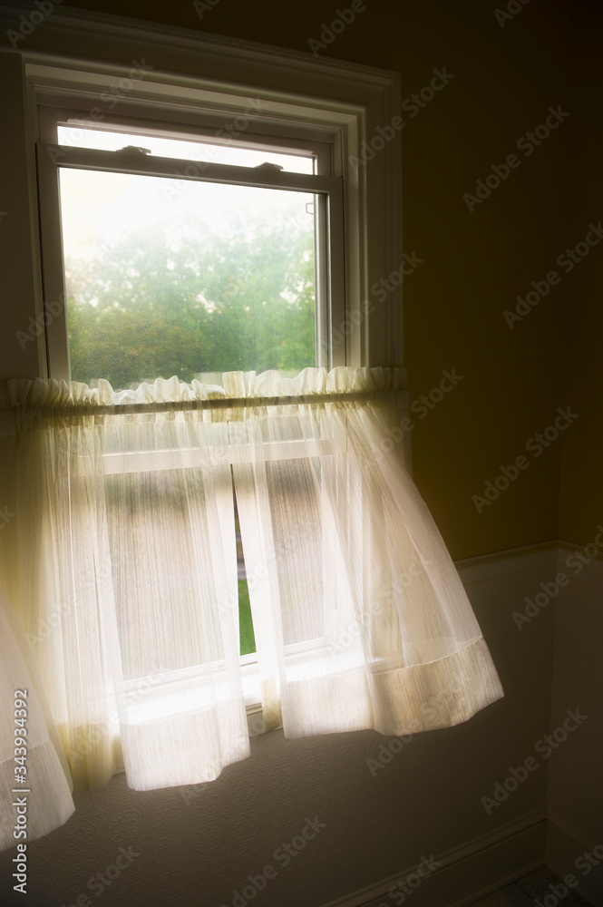 Wind blowing curtains through window Wind blowing curtains through window