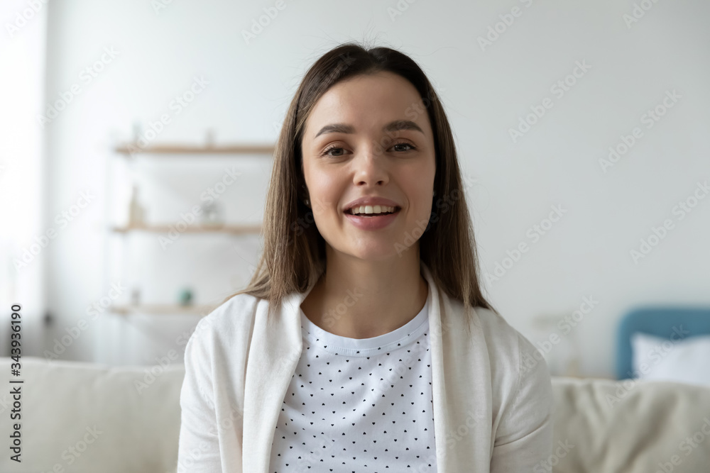 Headshot portrait of young woman sit on couch talk on video call at home, millennial girl blogger record live broadcast or tutorial on camera, female influencer or coach shoot vlog on social media Headshot portrait of young woman sit on couch talk on video call at home, millennial girl blogger record live broadcast or tutorial on camera, female influencer or coach shoot vlog on social media