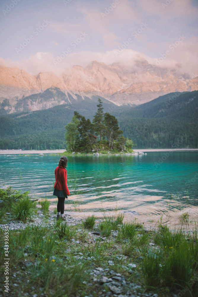 Germany, Bavaria, Eibsee, Young woman standing at shore of†Eibsee†lake in Bavarian Alps Germany, Bavaria, Eibsee, Young woman standing at shore of†Eibsee†lake in Bavarian Alps