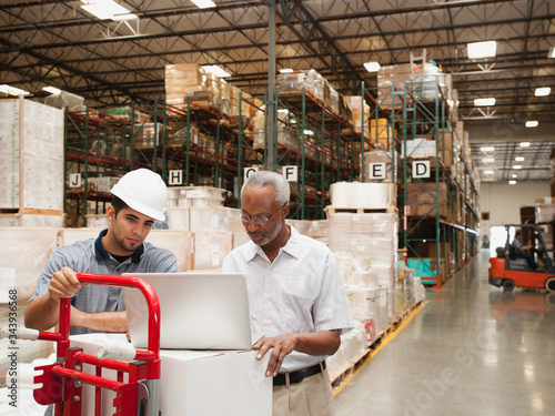 Men working in warehouse photo