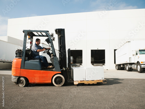 Man driving forklift photo