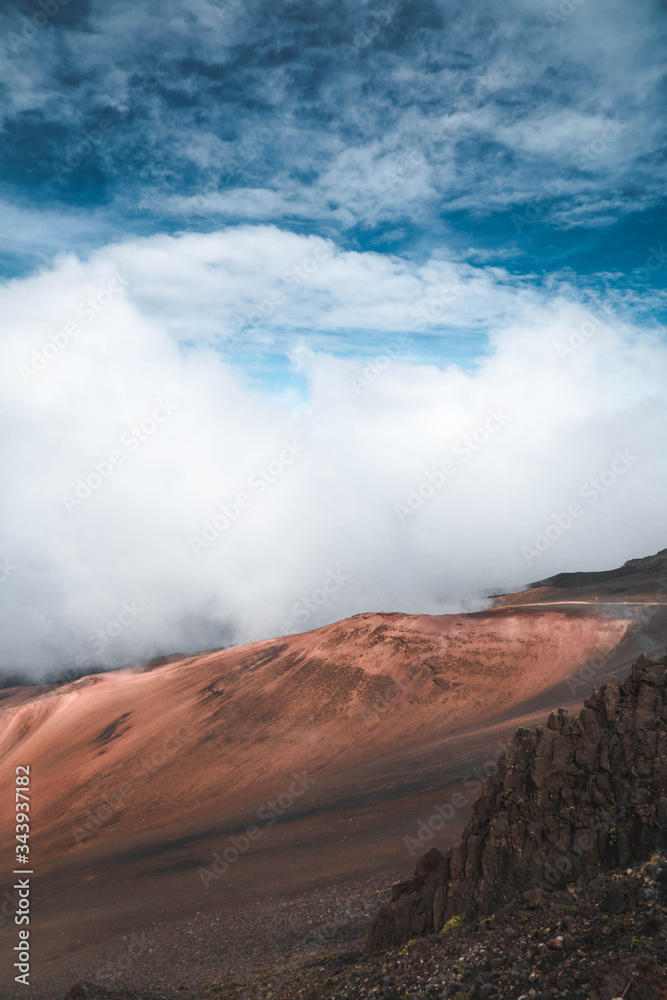 Volcanic landscape with clouds and blue sky 