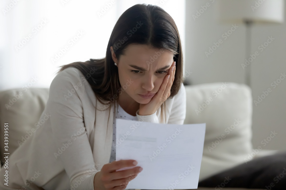 Upset young woman feel distressed get unpleasant bad news in paper correspondence, unhappy sad millennial female frustrated by negative letter response, receive eviction notice or payment delay Upset young woman feel distressed get unpleasant bad news in paper correspondence, unhappy sad millennial female frustrated by negative letter response, receive eviction notice or payment delay