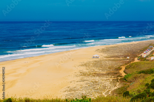 View of sandy North beach and blue Atlantc Ocean in Nazare  Portugal