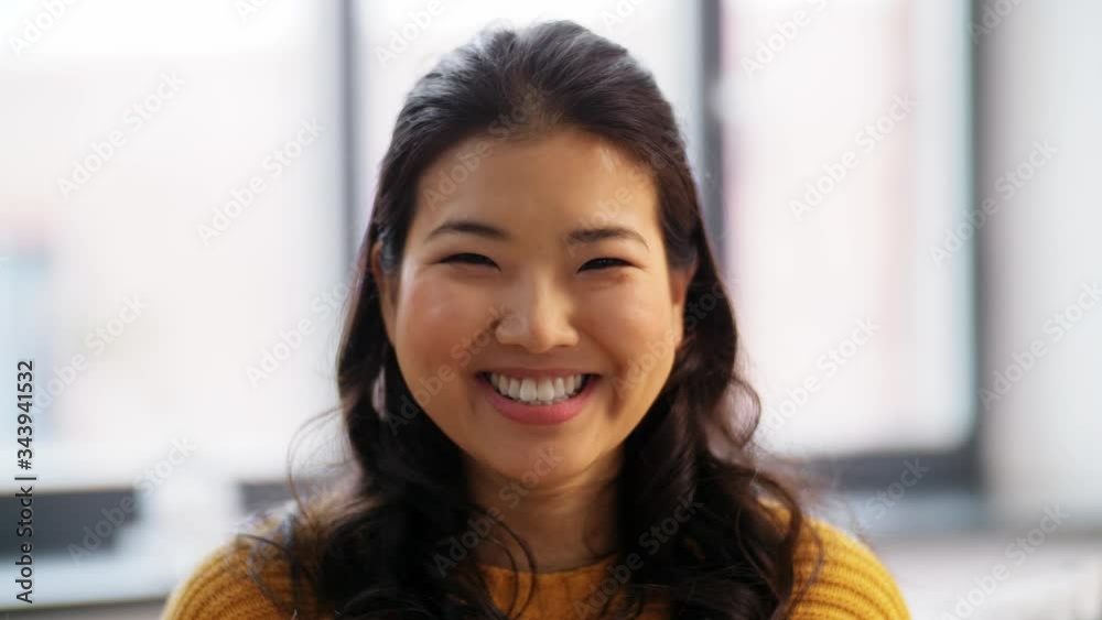 people, ethnicity and race concept - portrait of happy smiling asian young woman at home people, ethnicity and race concept - portrait of happy smiling asian young woman at home