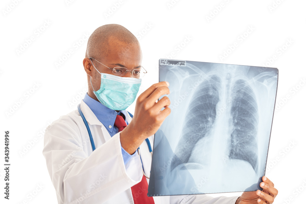 Doctor wearing a mask while holding a lung radiography