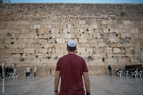 A man in a kippah in front of the Western Wall (Jerusalem)