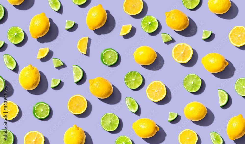 Fresh lemons and limes overhead view - flat lay Fresh lemons and limes overhead view - flat lay