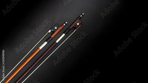 orange and brown violin bows