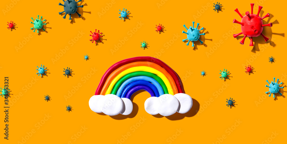 Fototapeta premium Hopes and wishes for the coronavirus situation with clay rainbow and viruses
