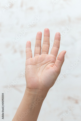 Hand shows number five, isolated background © donikz