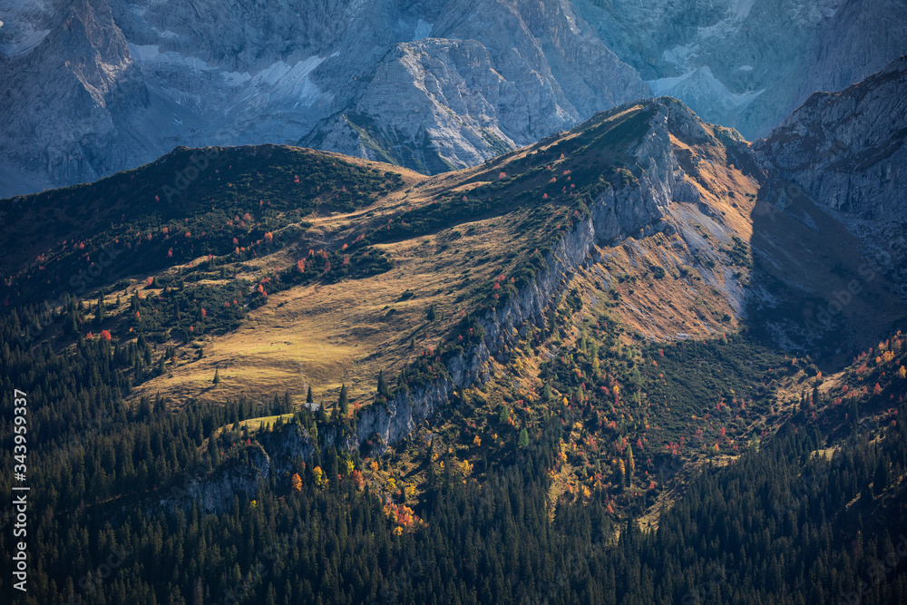 View from Kreuzeck into the valley Reintal and Wetterstein mountain chain during autumn, Garmisch-Partenkirchen Bavaria.