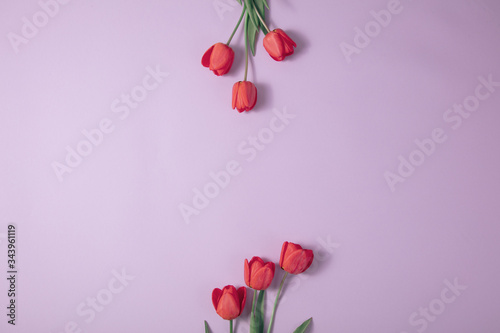 Bouquet of fresh spring tulips on the table with space top view. Spring pink vintage background.