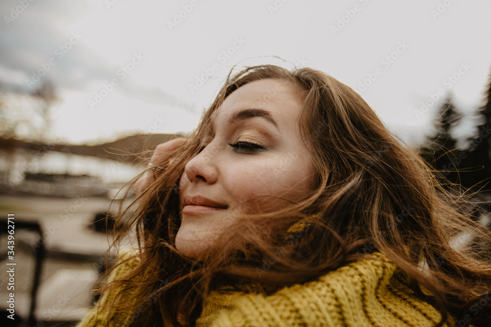 young beautiful girl in a yellow sweater young beautiful girl in a yellow sweater